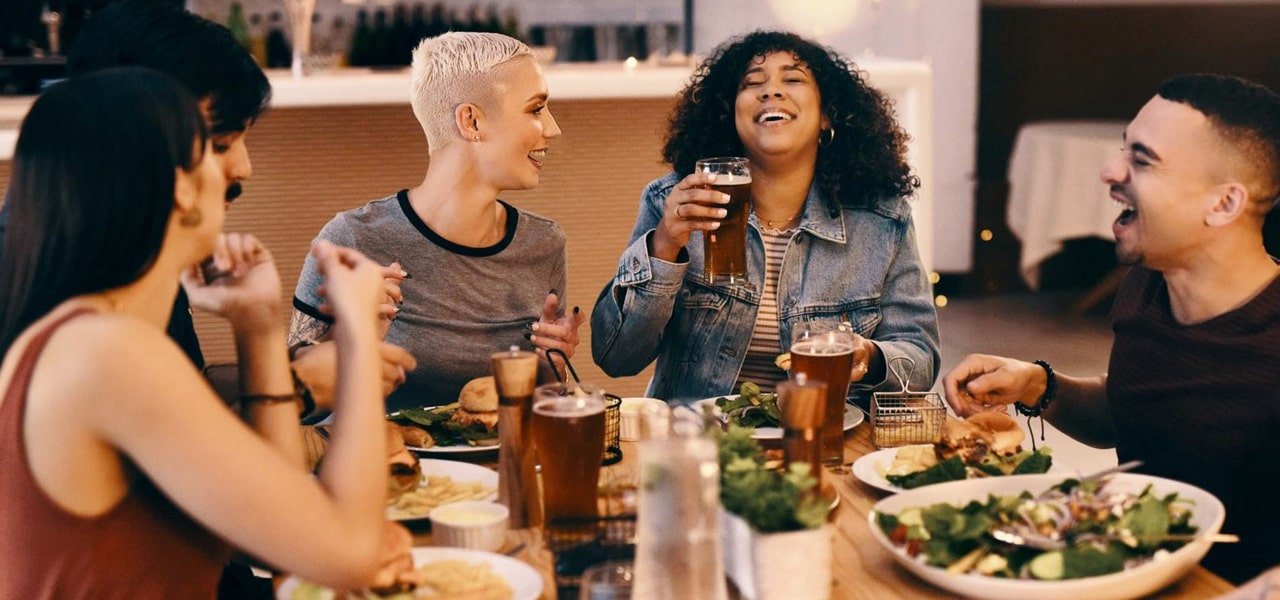 group of adults eating at local restaurant